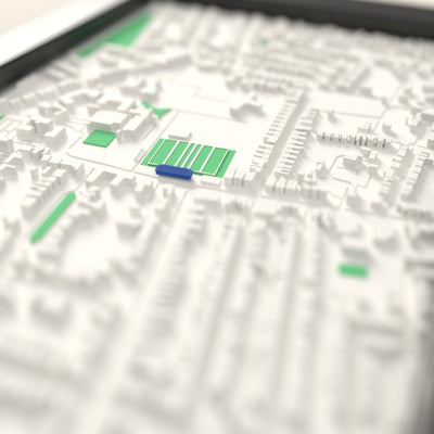 3D Goldington Road Map Framed - Close-up across the 3D map: the real Goldington Road stands with royal blue seats around the green pitch