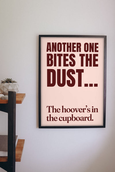 Funny Another One Bites the Dust lyric print framed on a wall
