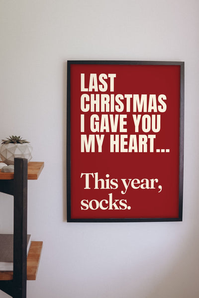 Funny Last Christmas lyric print framed on a wall