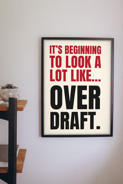 Funny It's Beginning to Look a Lot Like Christmas lyric print framed on a wall