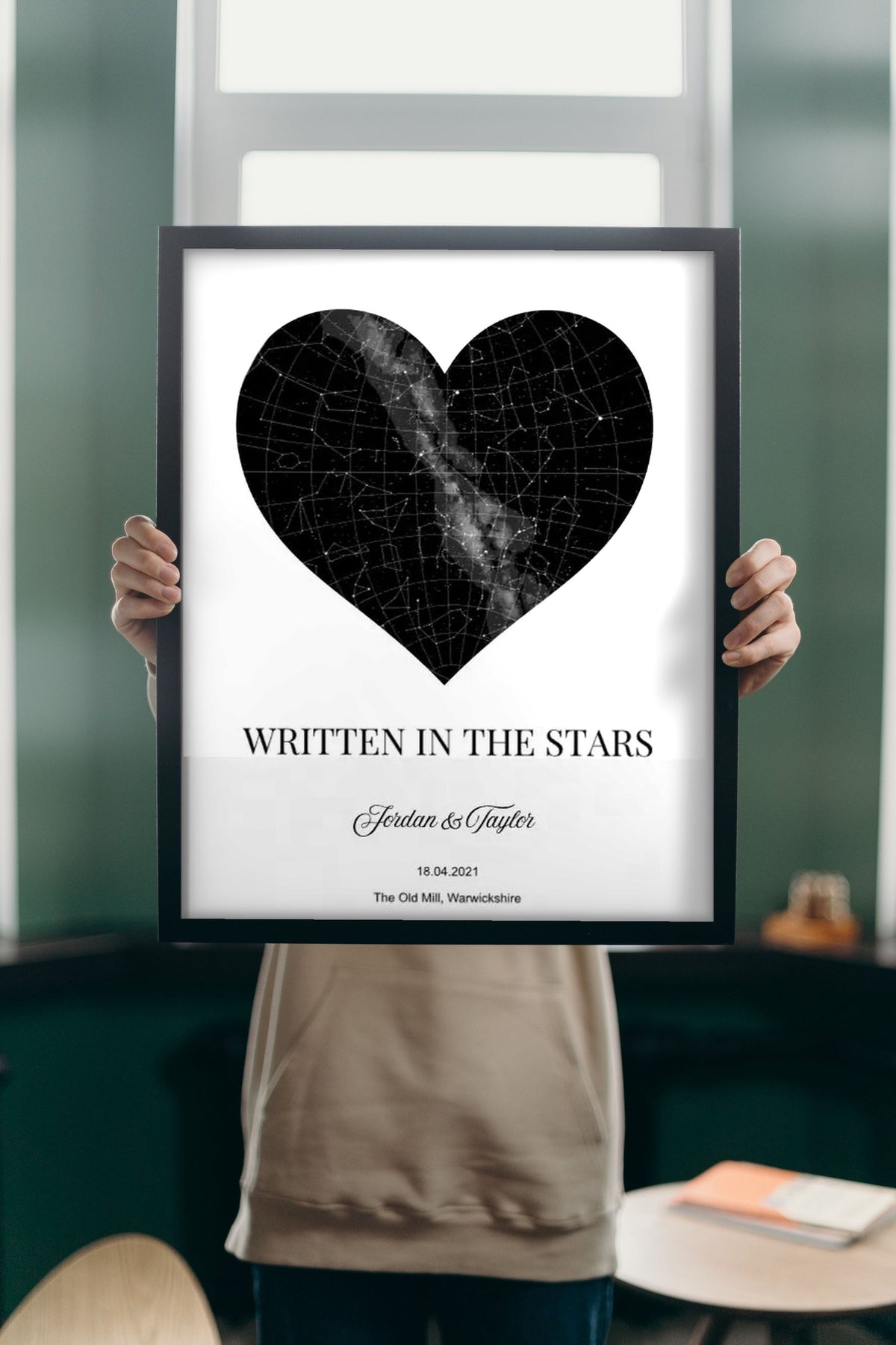 Lifestyle - Personalised Star Map Heart Print held up in a bright room