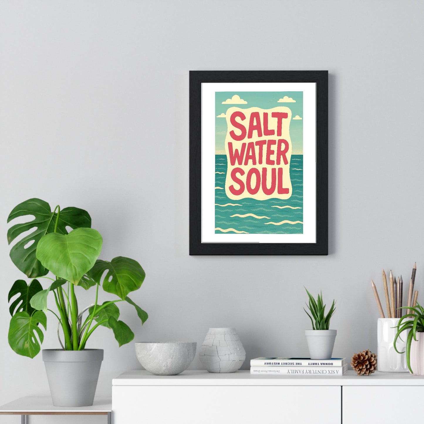 Salt Water Soul coastal poster framed on living room wall above furniture