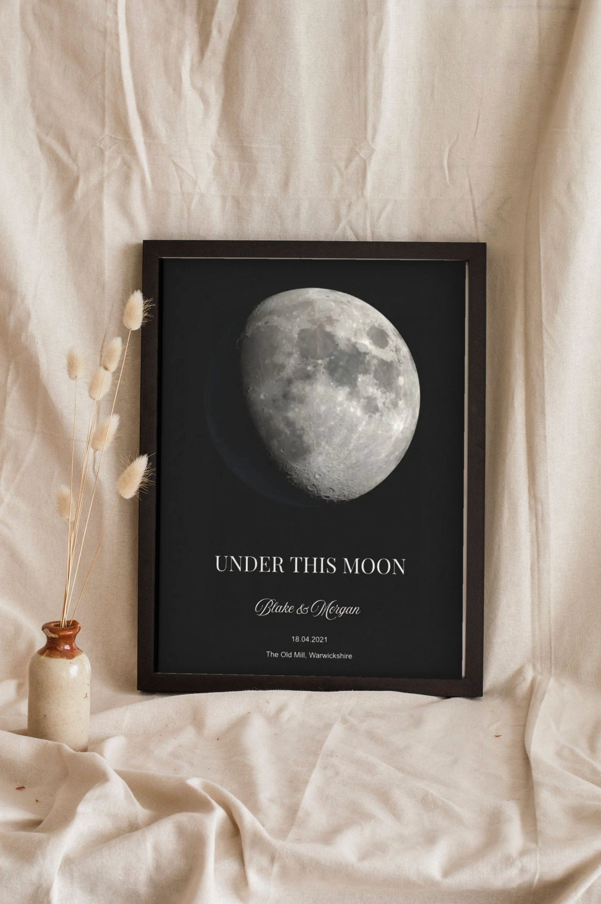 Lifestyle - Personalised Moon Phase Print leaning in a frame with dried flowers