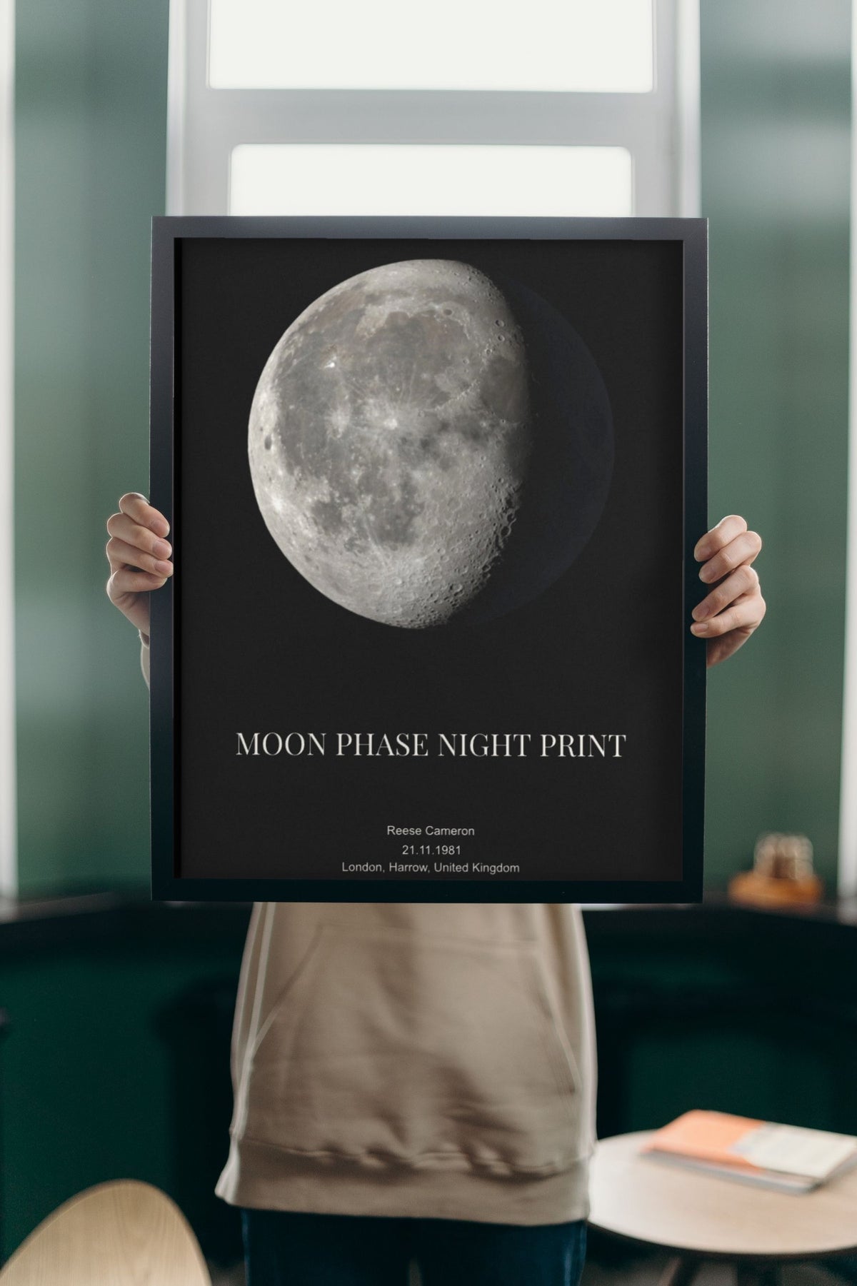 Lifestyle - Personalised Moon Phase Print held up in a bright room