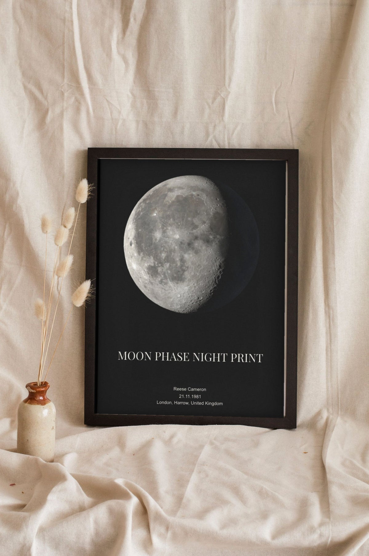 Lifestyle - Personalised Moon Phase Print leaning in a frame with dried flowers