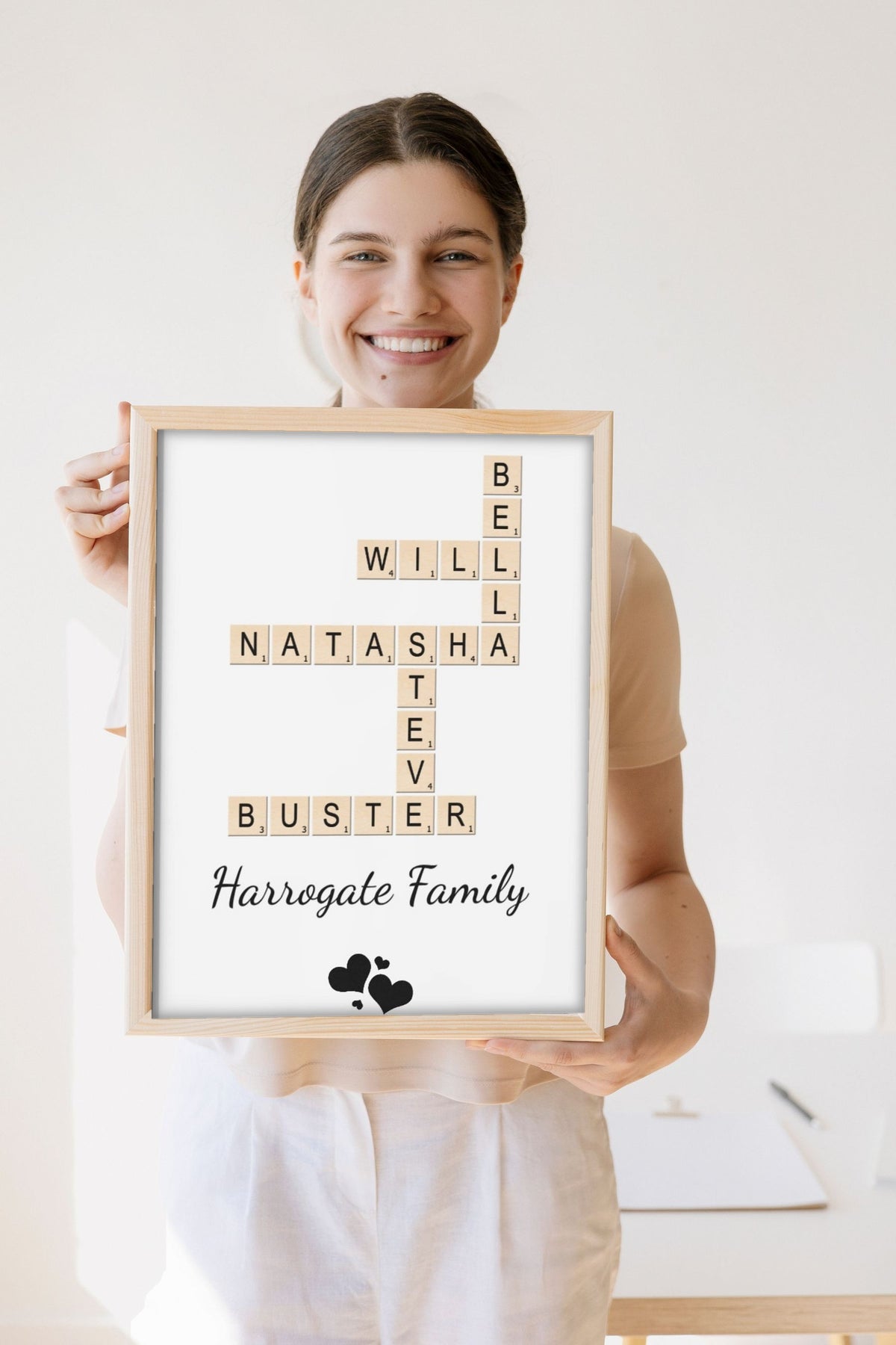 Lifestyle - Personalised Family Name Scrabble Print held by a smiling woman