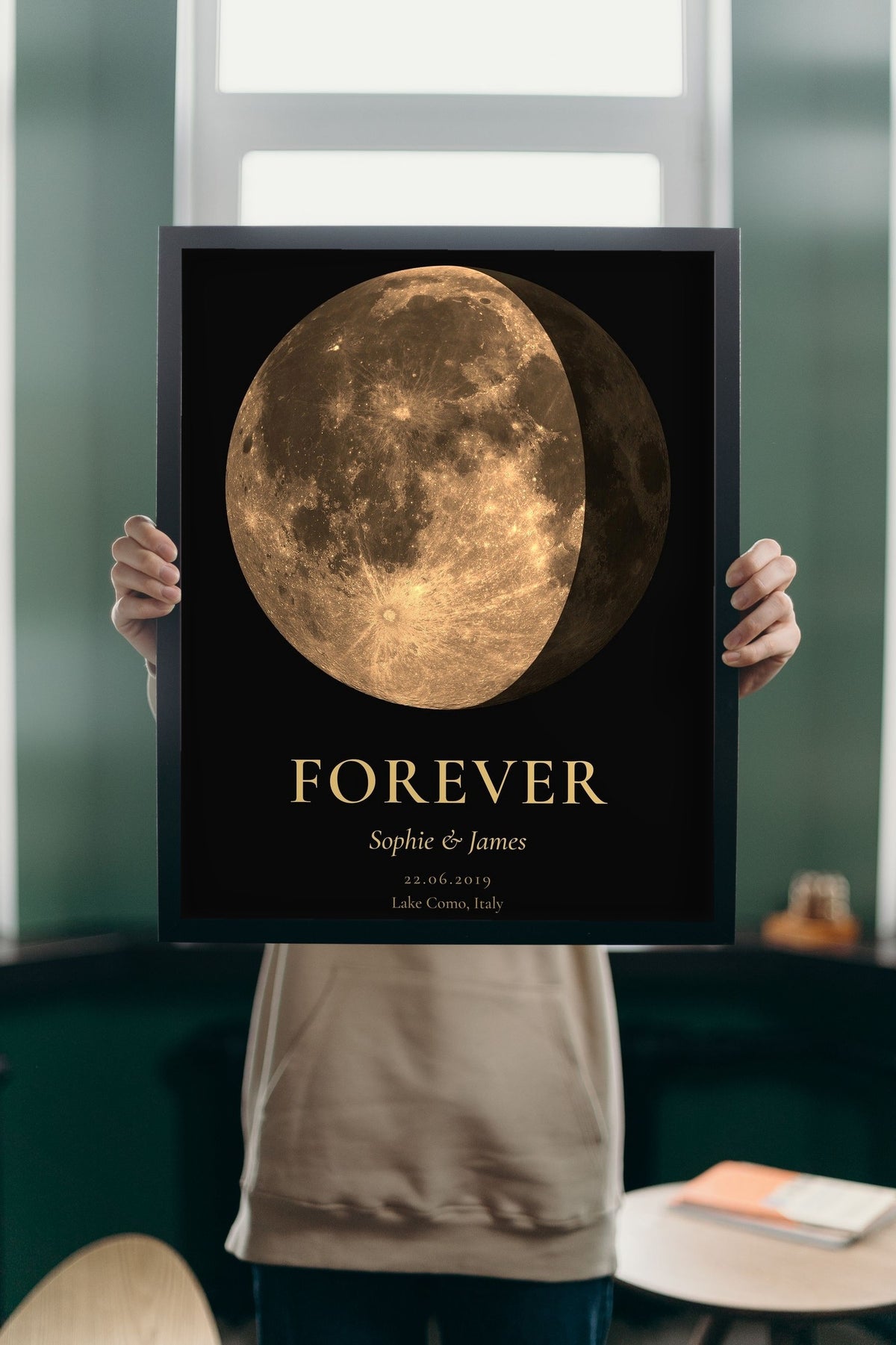 Lifestyle - Personalised Anniversary Moon Phase Print held up in a bright room