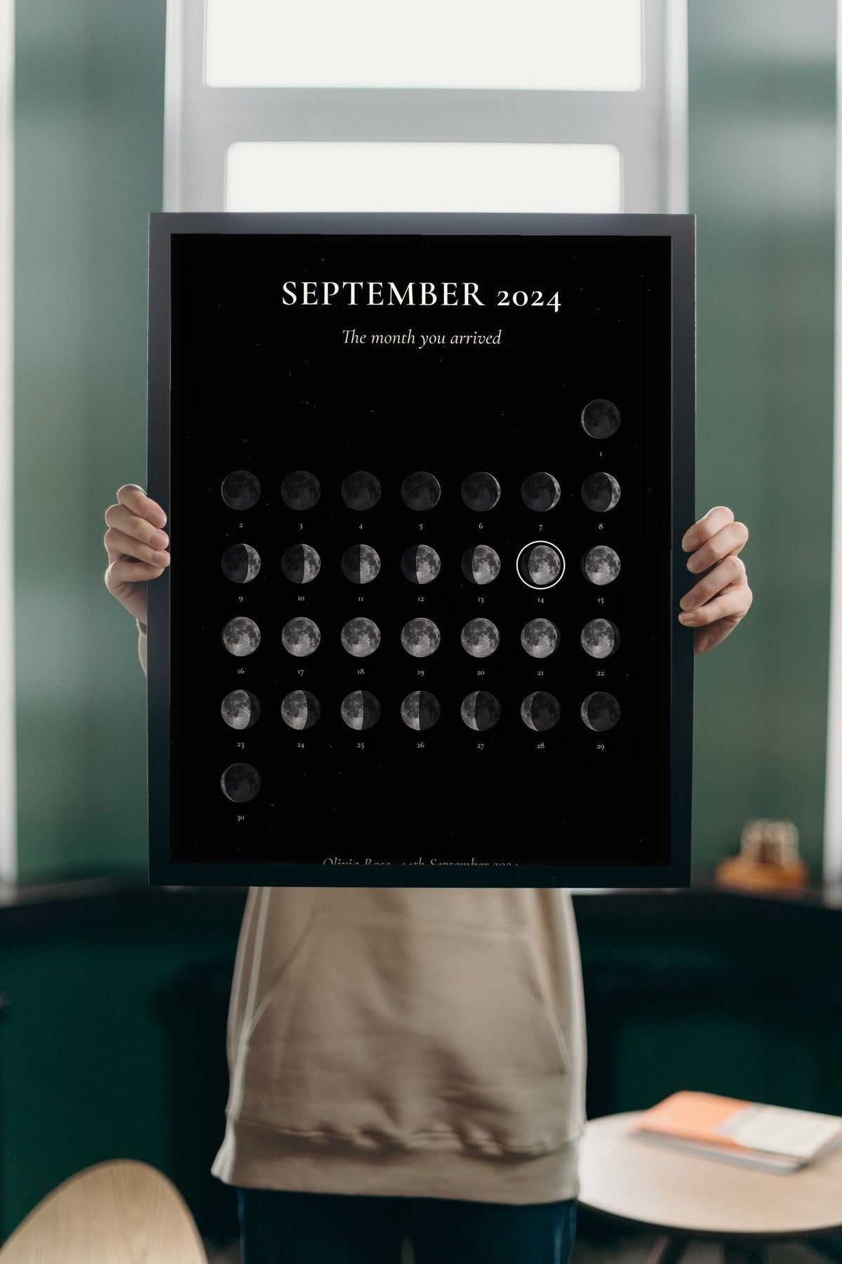 Lifestyle - Personalised Moon Calendar Print held up in a bright room