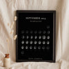 Lifestyle - Personalised Moon Calendar Print leaning in a frame with dried flowers