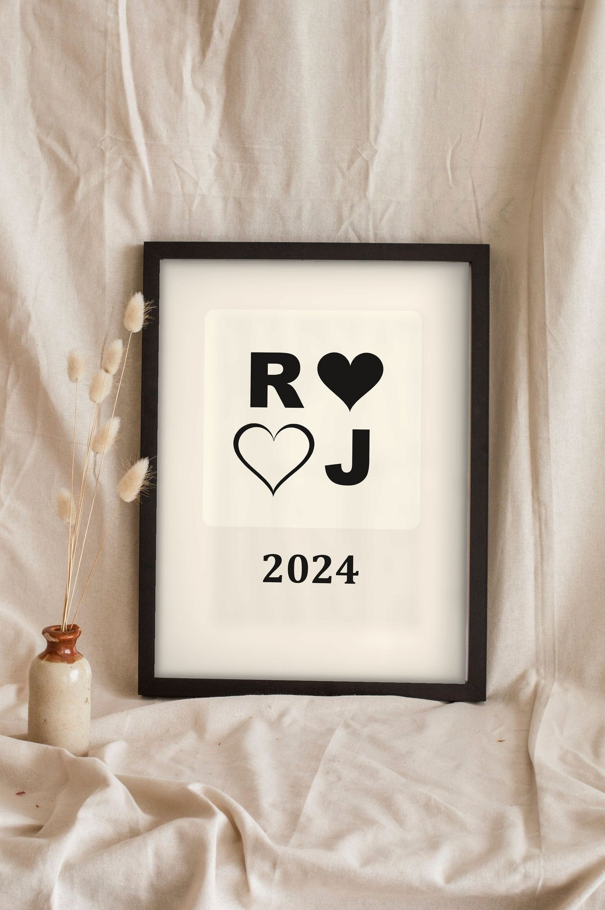 Lifestyle - Personalised Couples Anniversary Print leaning in a frame with dried flowers