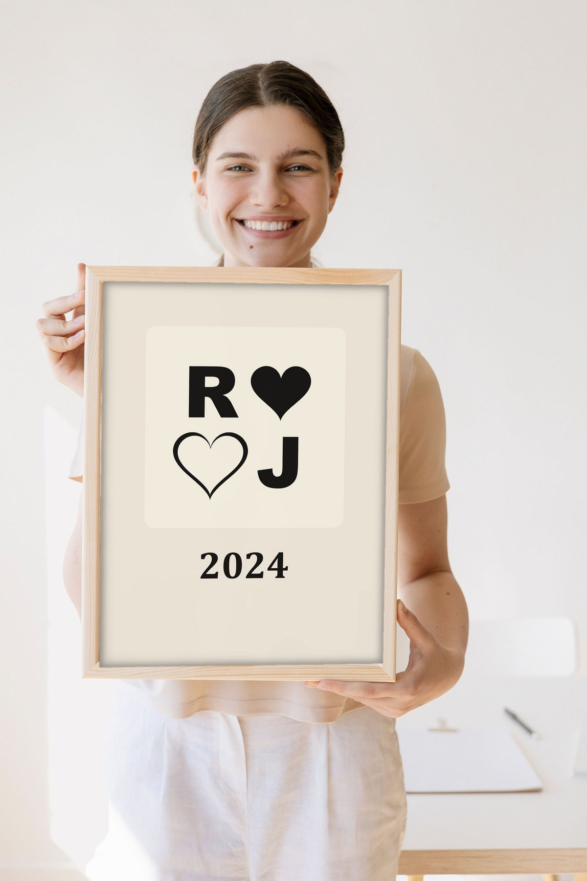 Lifestyle - Personalised Couples Anniversary Print held by a smiling woman