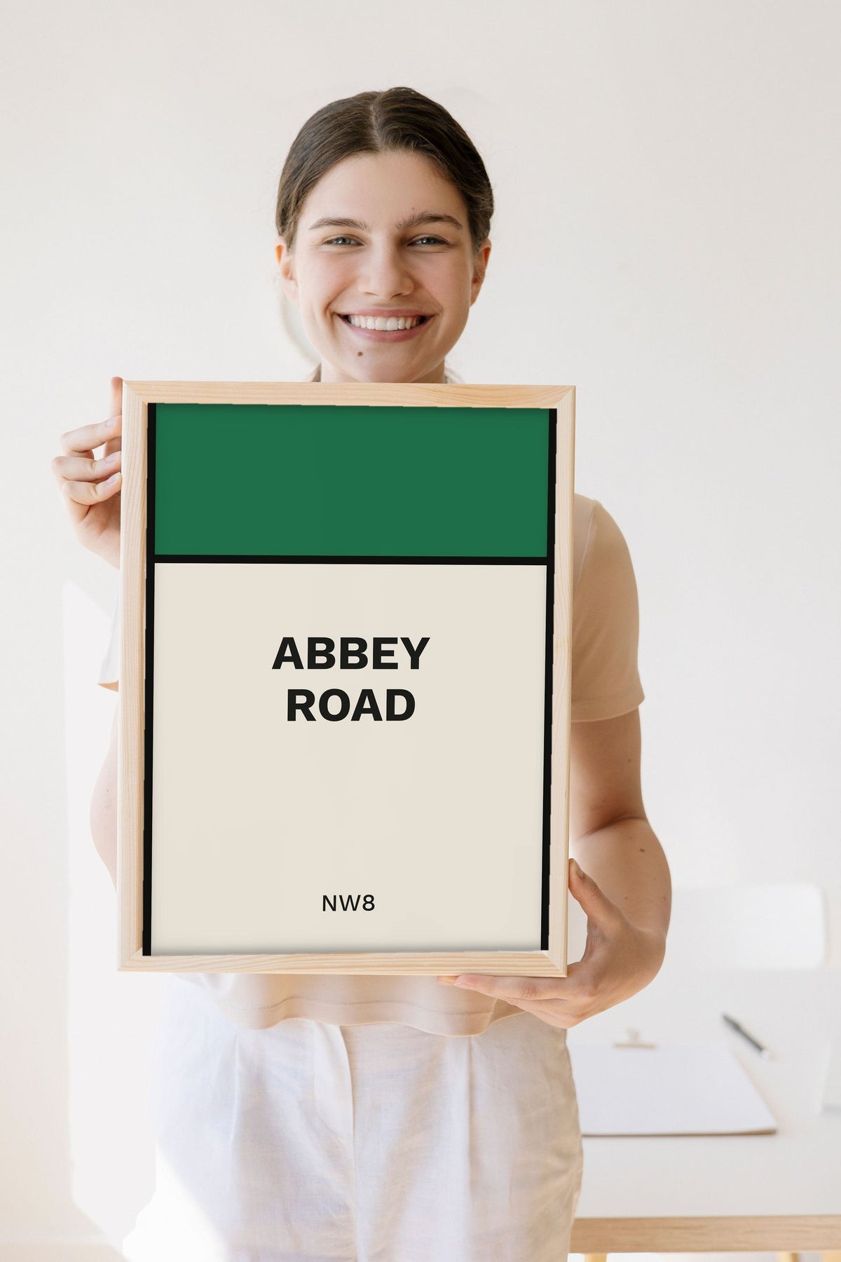 Lifestyle - Personalised Street Sign Print held by a smiling woman