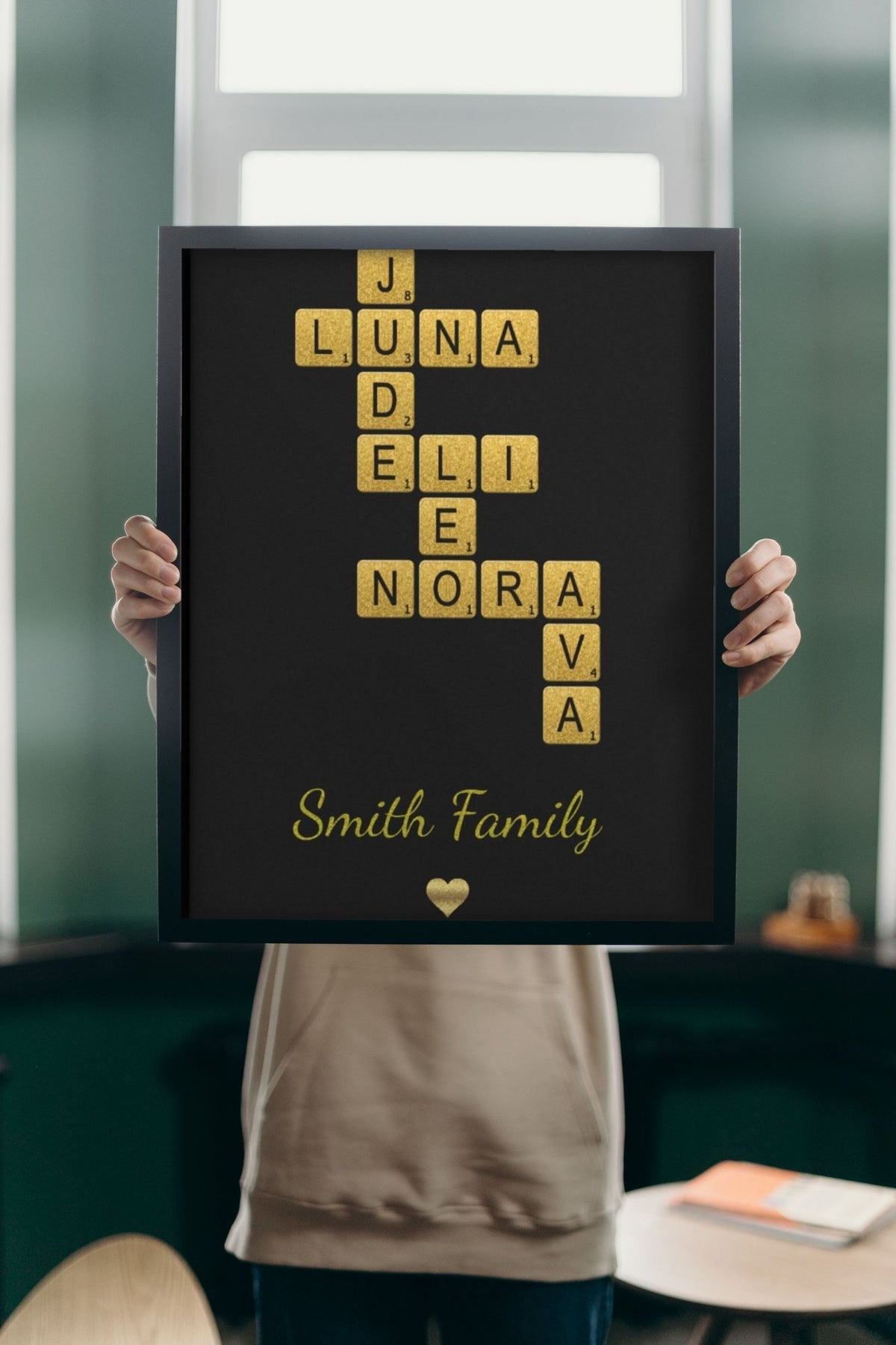 Lifestyle - Personalised Glitter Family Name Scrabble Print held up in a bright room