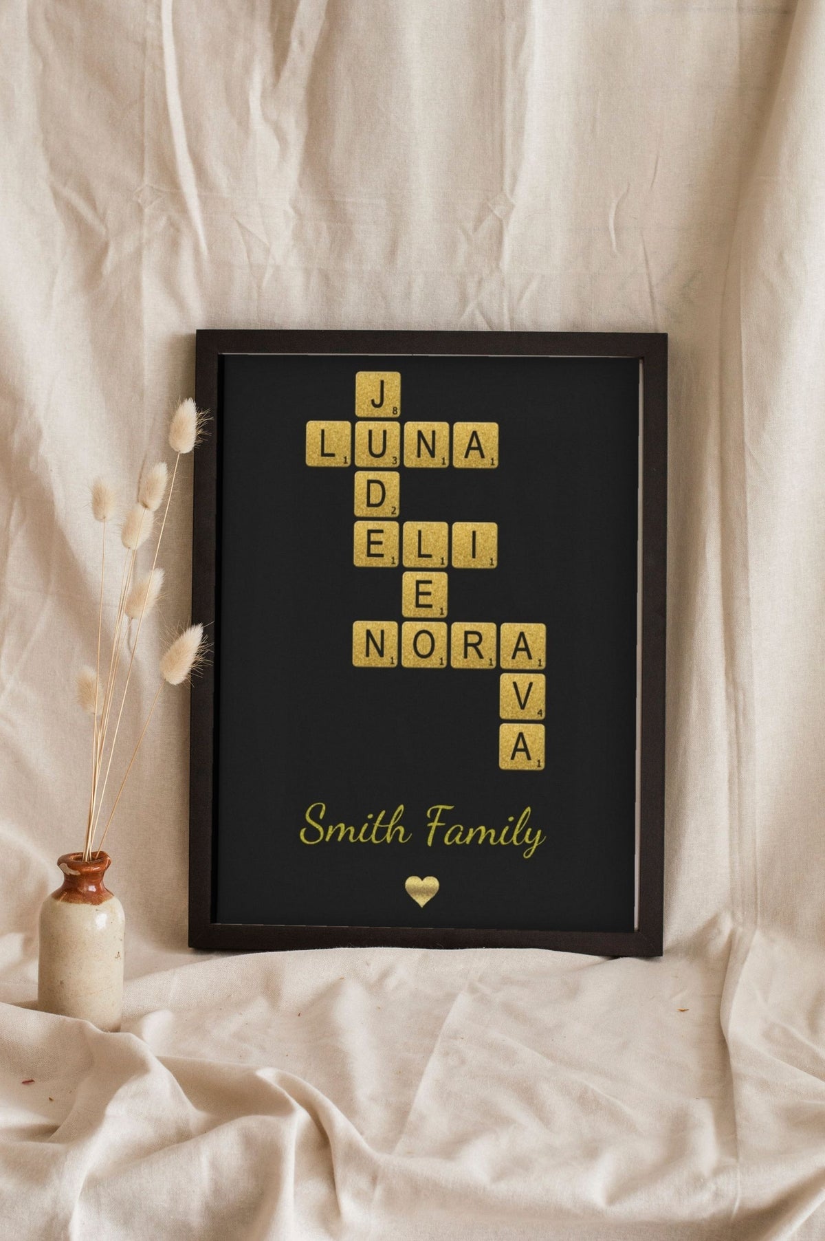 Lifestyle - Personalised Glitter Family Name Scrabble Print leaning in a frame with dried flowers