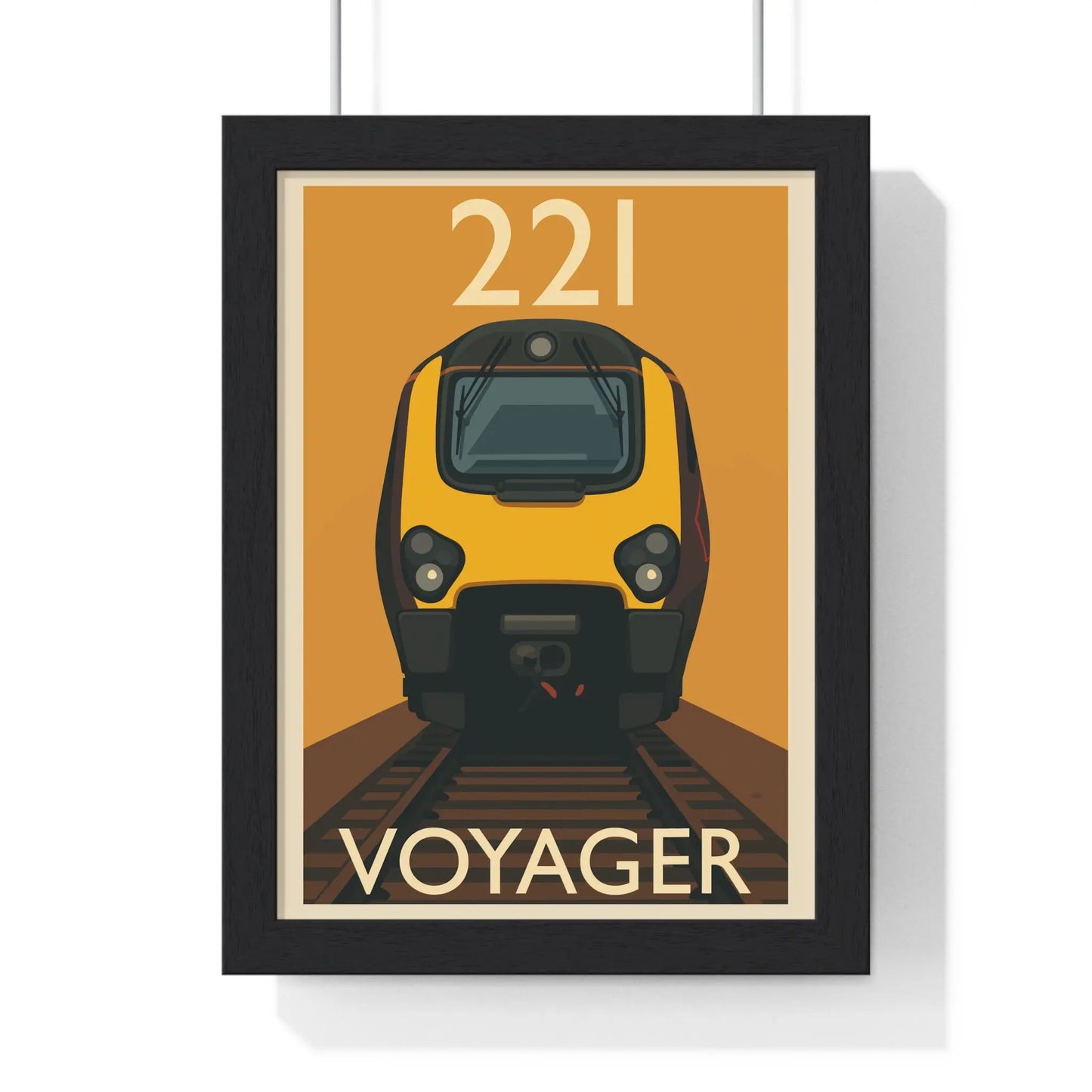 Framed poster of a yellow train labeled 'Voyager' with the number '221' on an orange background.