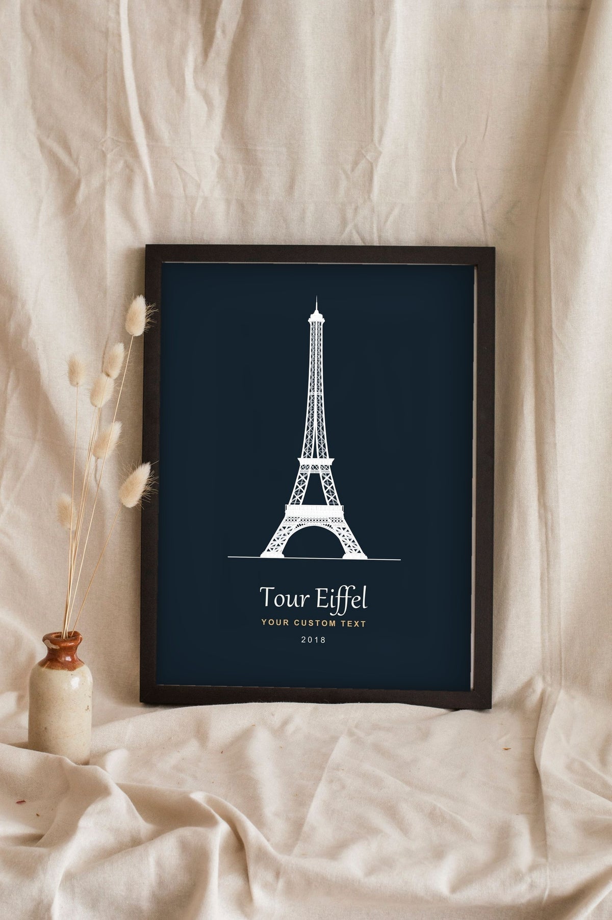 Lifestyle - Personalised Eiffel Tower Line Art Print leaning in a frame with dried flowers