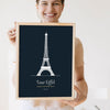 Lifestyle - Personalised Eiffel Tower Line Art Print held by a smiling woman