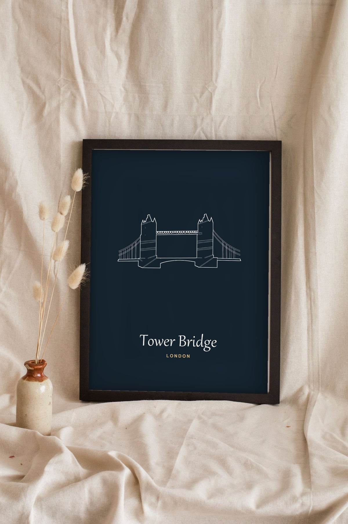 Lifestyle - Personalised Tower Bridge Line Art Print leaning in a frame with dried flowers