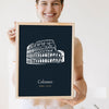 Lifestyle - Personalised Colosseum Line Art Print held by a smiling woman