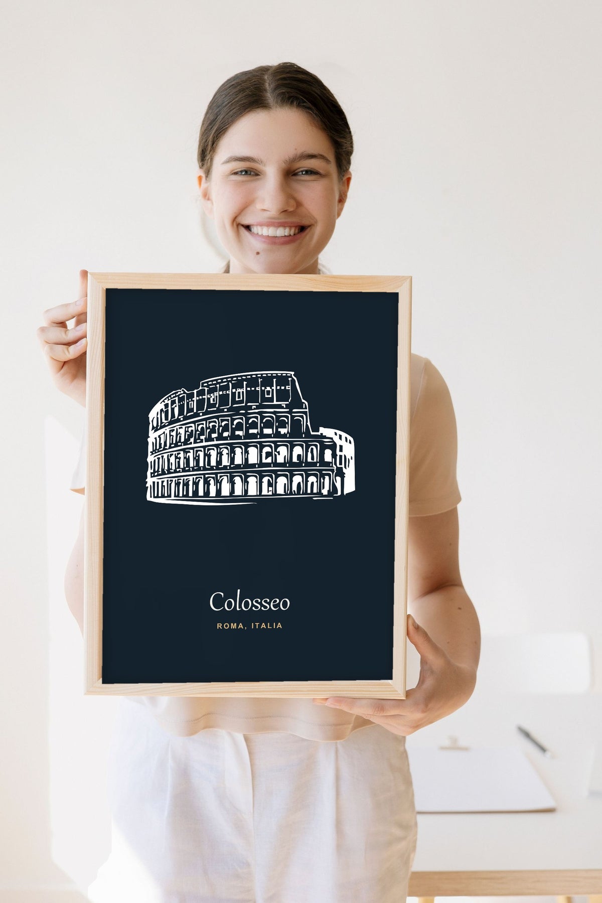 Lifestyle - Personalised Colosseum Line Art Print held by a smiling woman