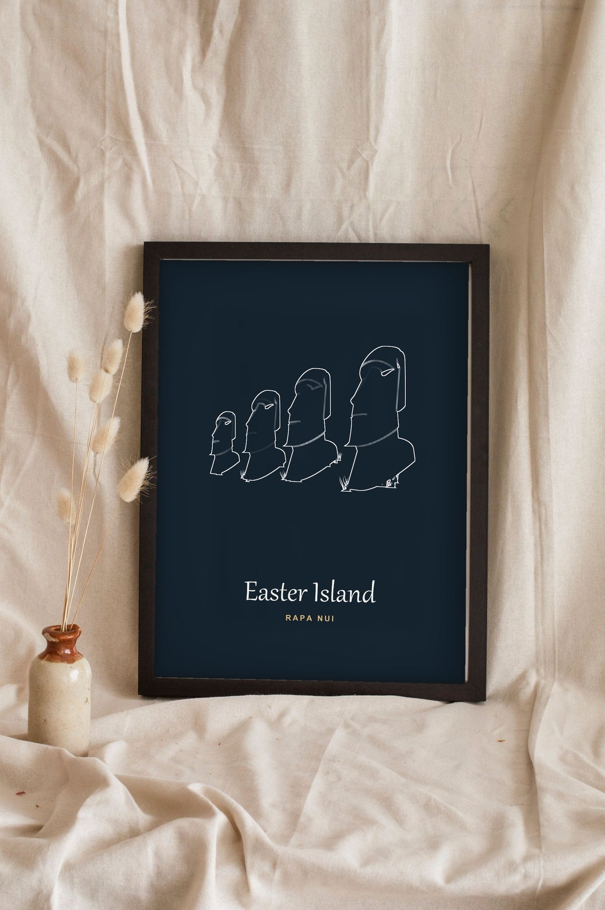 Lifestyle - Personalised Easter Island Line Art Print leaning in a frame with dried flowers