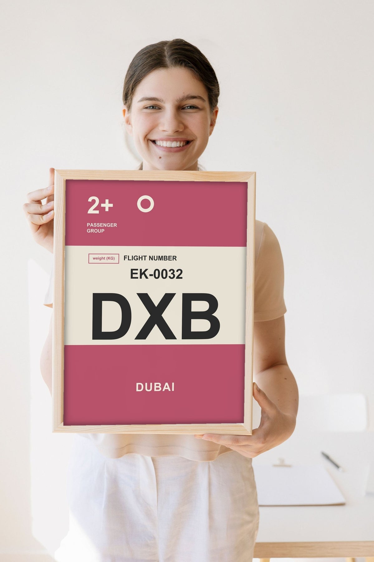 Lifestyle - Personalised Boarding Pass Print held by a smiling woman