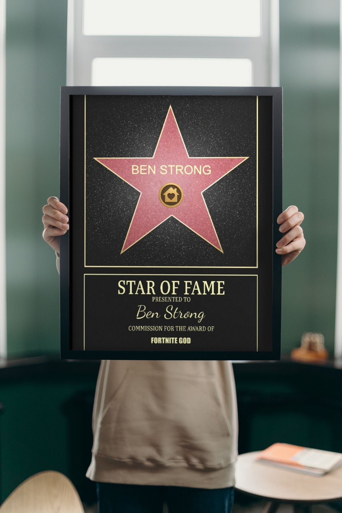 Lifestyle - Personalised Walk of Fame Star Print held up in a bright room
