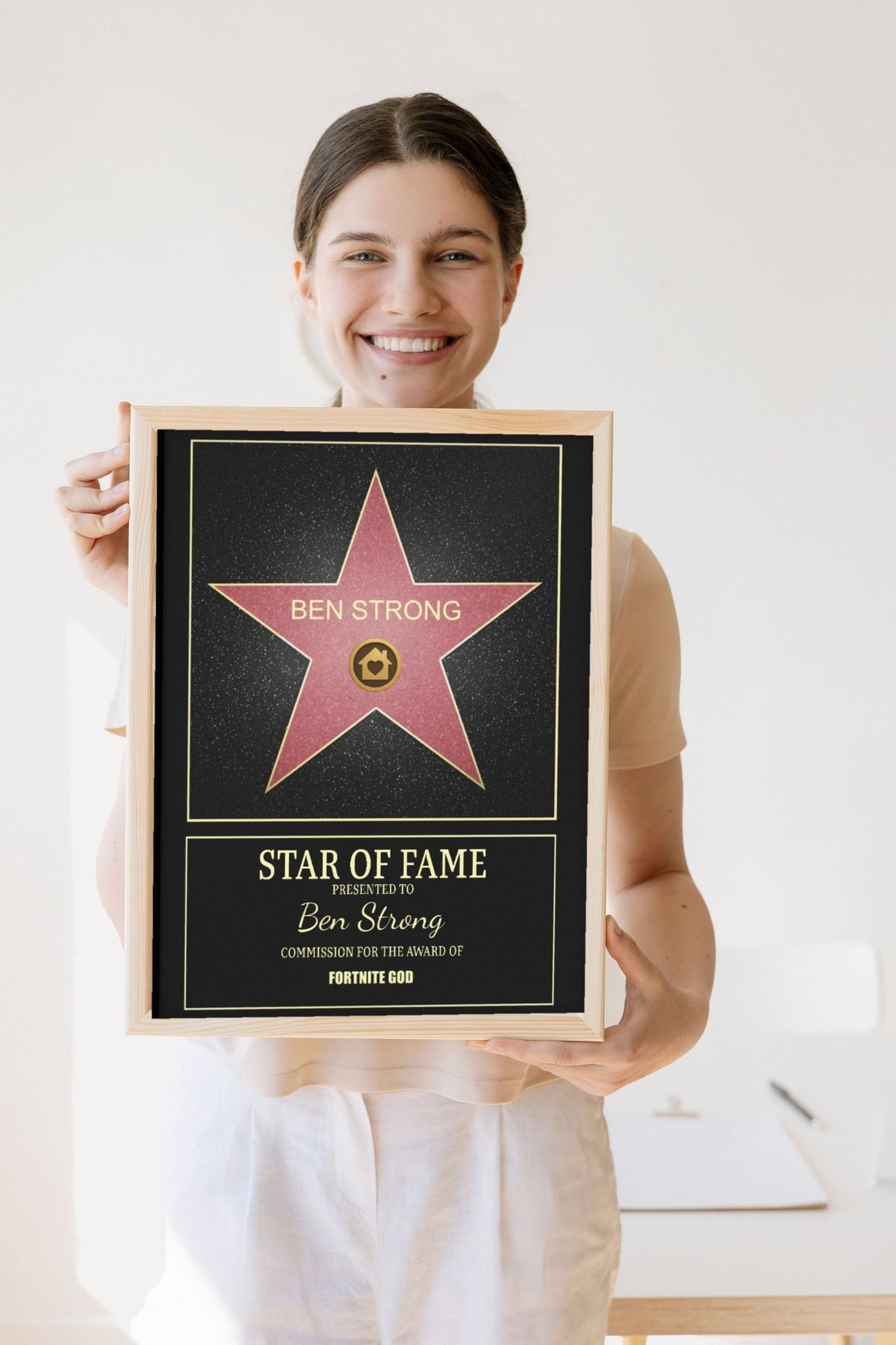 Lifestyle - Personalised Walk of Fame Star Print held by a smiling woman