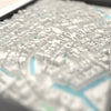 3D Amsterdam Map Framed - Close-up across the 3D Amsterdam map showing the raised streets and buildings