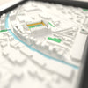 3D Carrow Road Map Framed - Close-up across the 3D map: the real Carrow Road stands with yellow seats around the green pitch