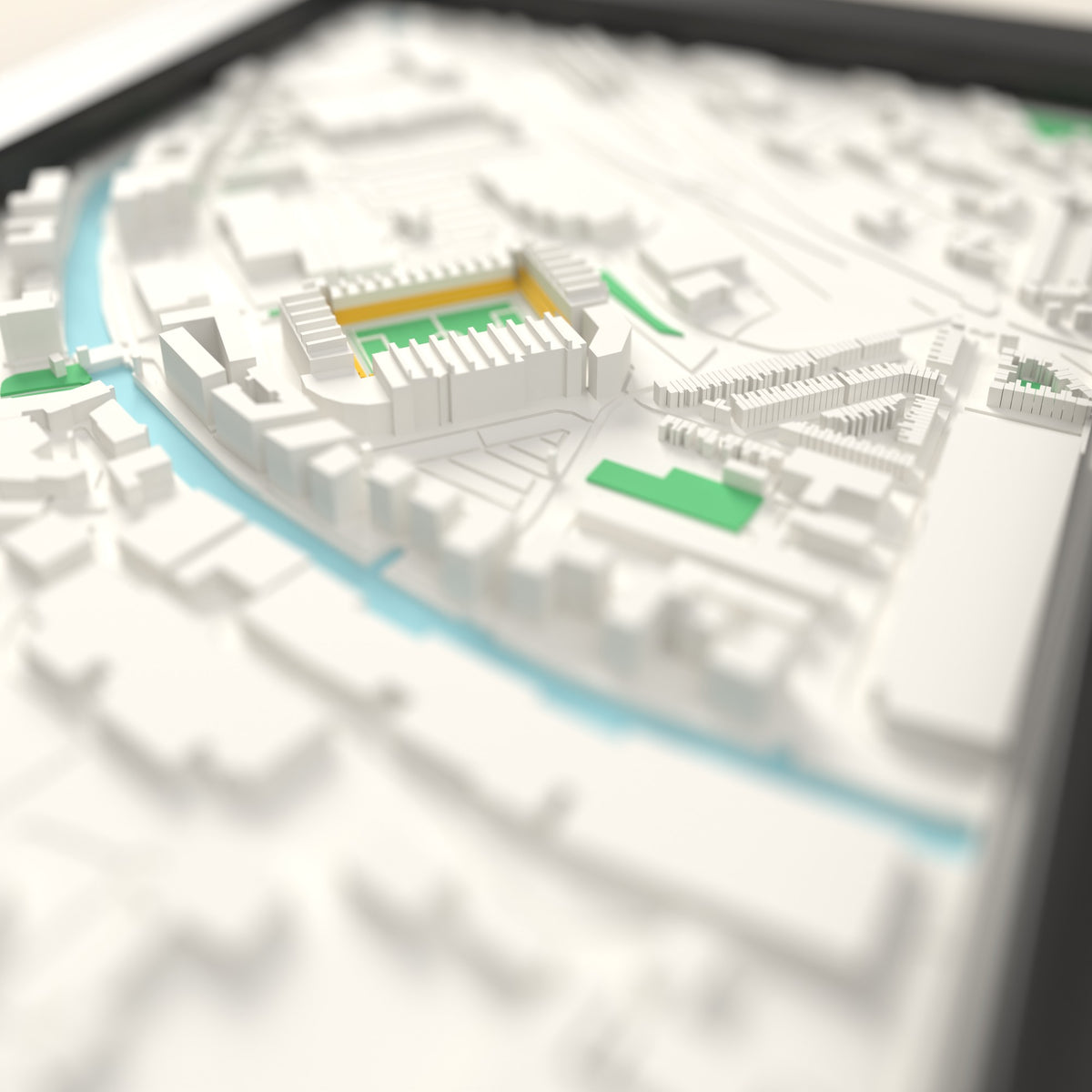 3D Carrow Road Map Framed - Close-up across the 3D map: the real Carrow Road stands with yellow seats around the green pitch