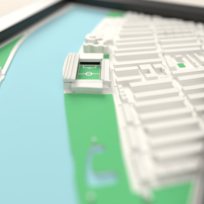 3D Craven Cottage Map Framed - Close-up across the 3D map: the real Craven Cottage stands with black seats around the green pitch