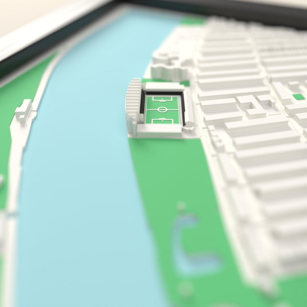 3D Craven Cottage Map Framed - Close-up across the 3D map: the real Craven Cottage stands with black seats around the green pitch