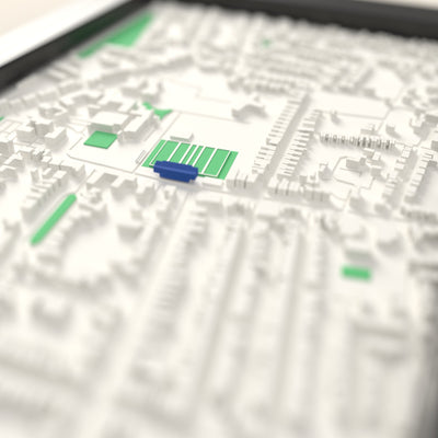 3D Goldington Road Map Framed - Close-up across the 3D map: the real Goldington Road stands with royal blue seats around the green pitch