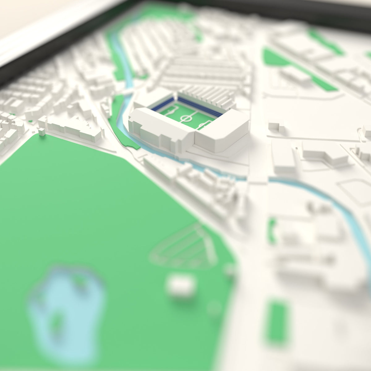 3D Hillsborough Map Framed - Close-up across the 3D map: the real Hillsborough stands with royal blue seats around the green pitch