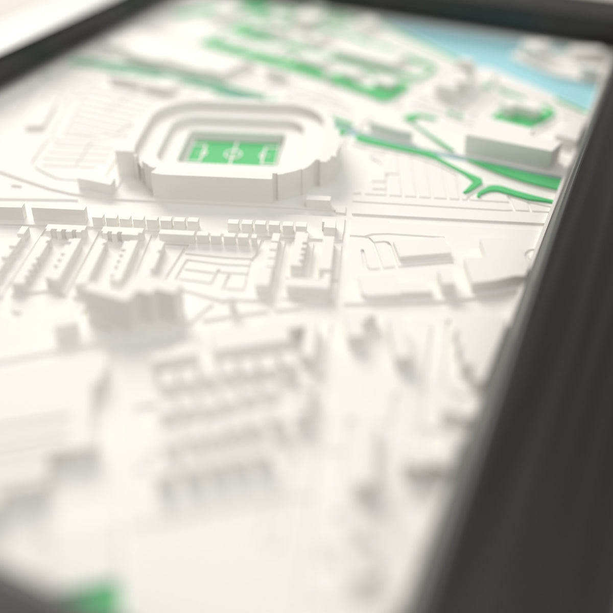 3D Old Trafford Map Framed - Close-up across the 3D map showing the Old Trafford stands and green pitch standing up from the streets