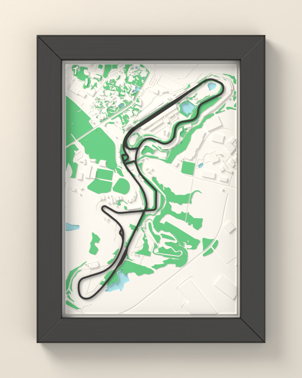 3D Suzuka Circuit Map Framed - 3D printed Suzuka Circuit map in a black wooden A5 frame, the track raised in dark grey
