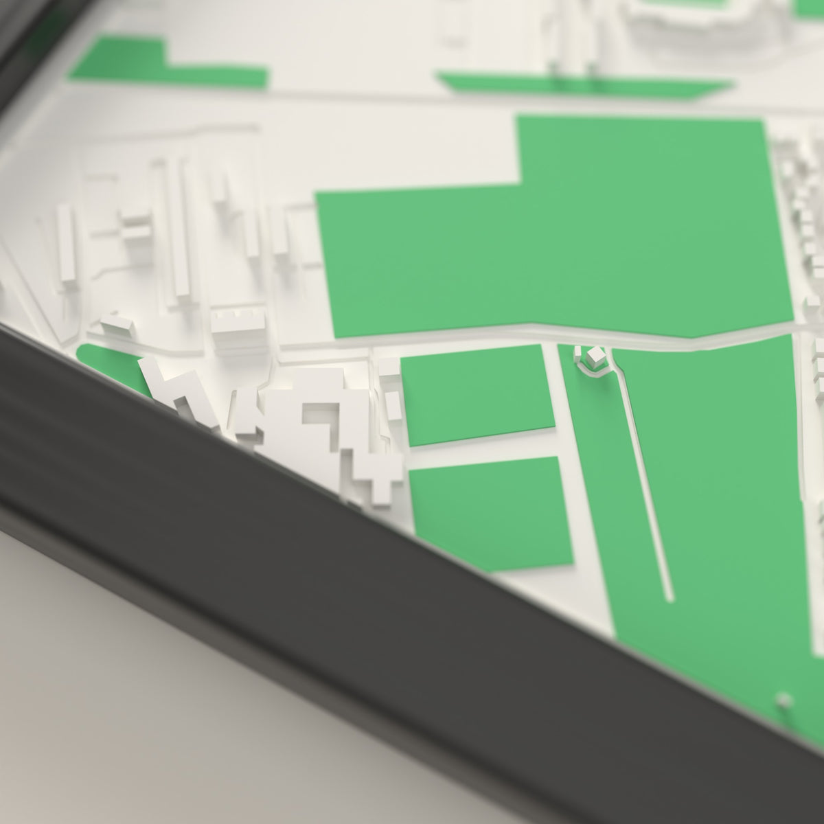 3D The Jungle Map Framed - Close-up of the raised streets and buildings around The Jungle on the 3D printed map