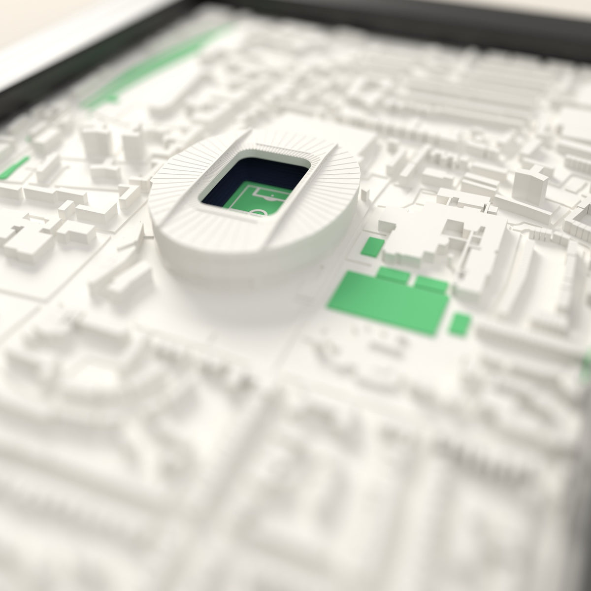 3D Tottenham Hotspur Stadium Map Framed - Close-up across the 3D map: the real Tottenham Hotspur Stadium stands with navy seats around the green pitch