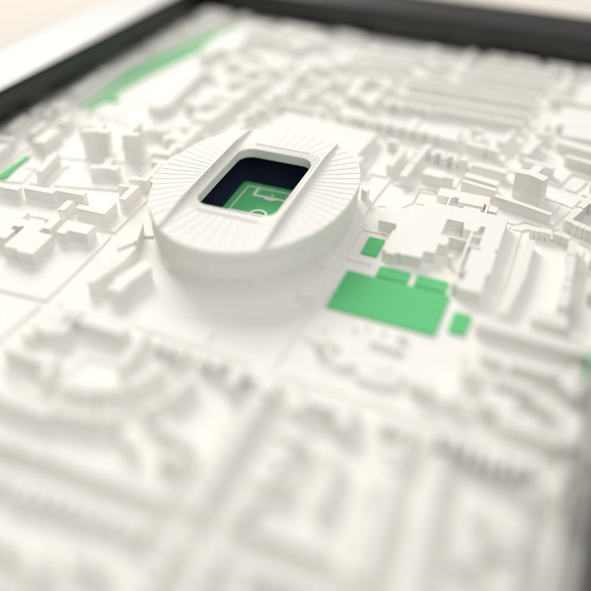 3D Tottenham Hotspur Stadium Map Framed - Close-up across the 3D map: the real Tottenham Hotspur Stadium stands with navy seats around the green pitch