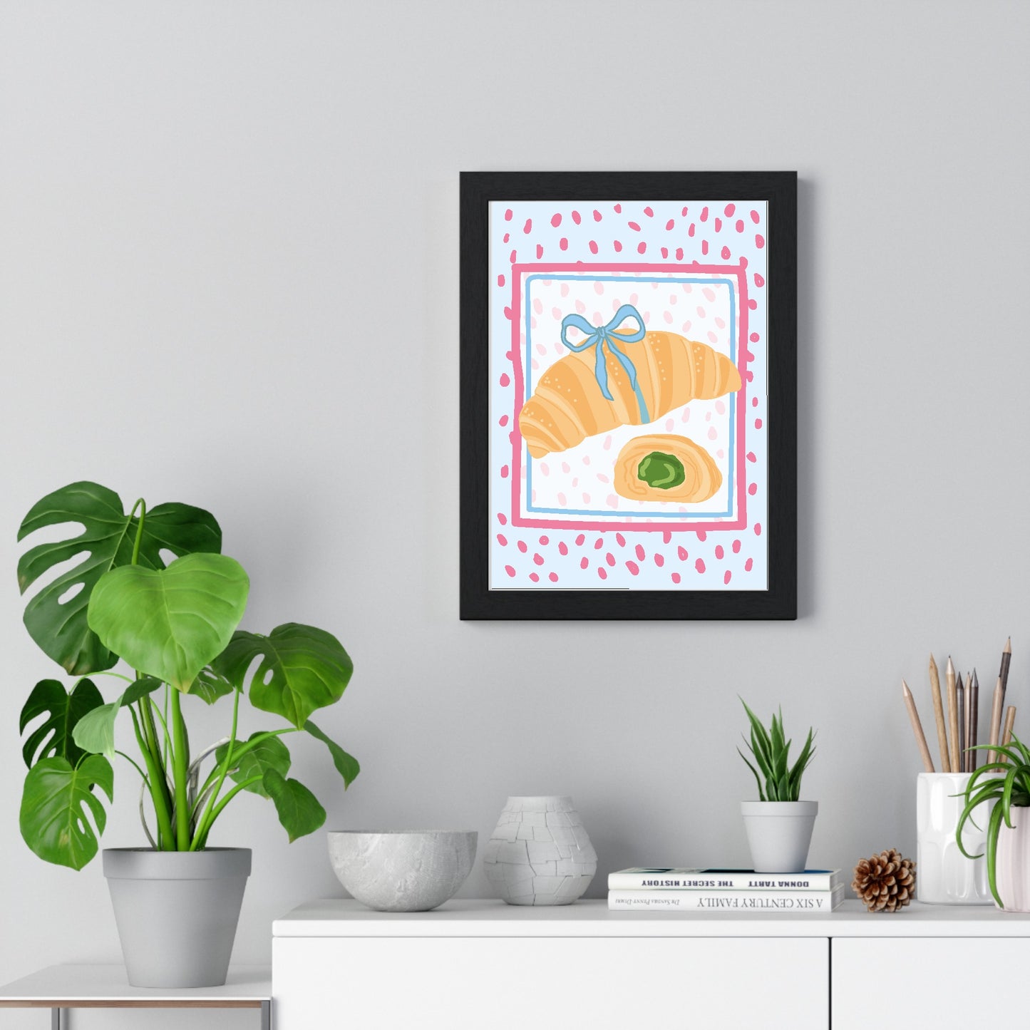 Croissant with Matcha framed poster displayed on living room wall above furniture