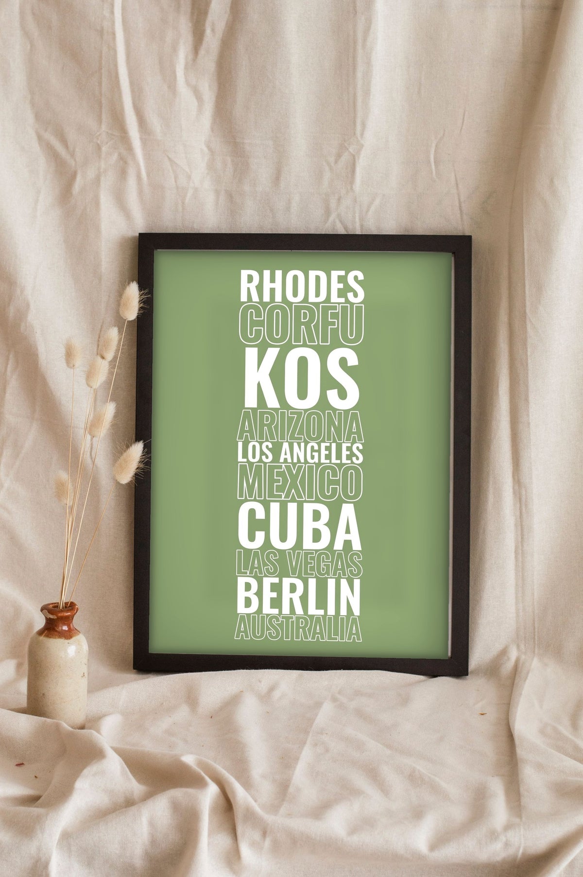 Lifestyle - Personalised Travel Destination Print leaning in a frame with dried flowers