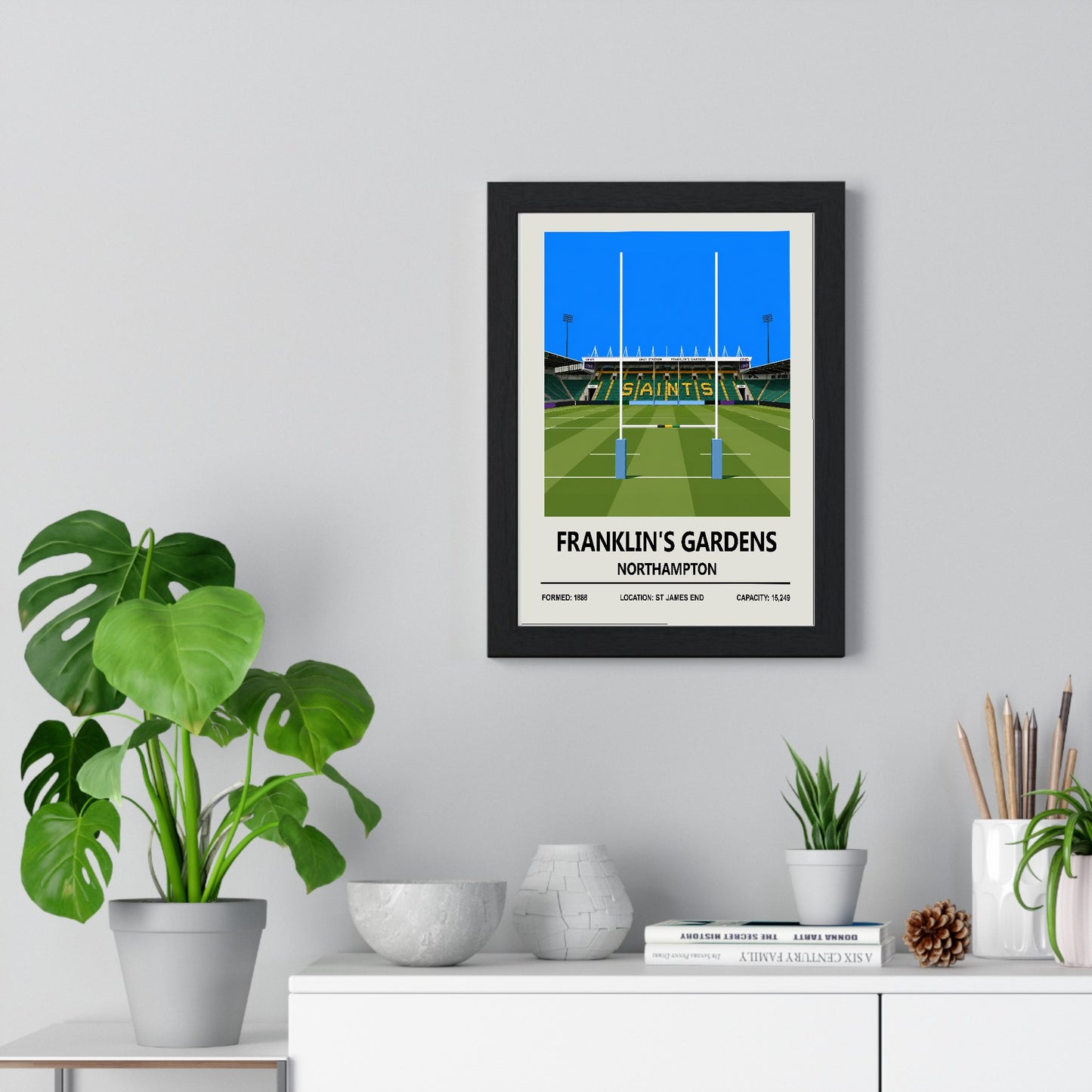 Franklin's Gardens Copy poster framed on living room wall above furniture
