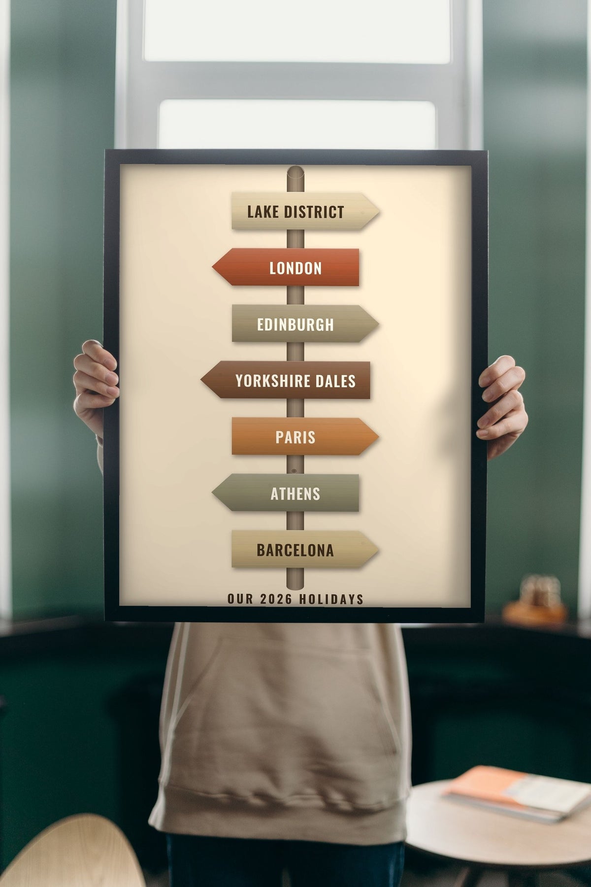 Lifestyle - Personalised Travel Signpost Print held up in a bright room