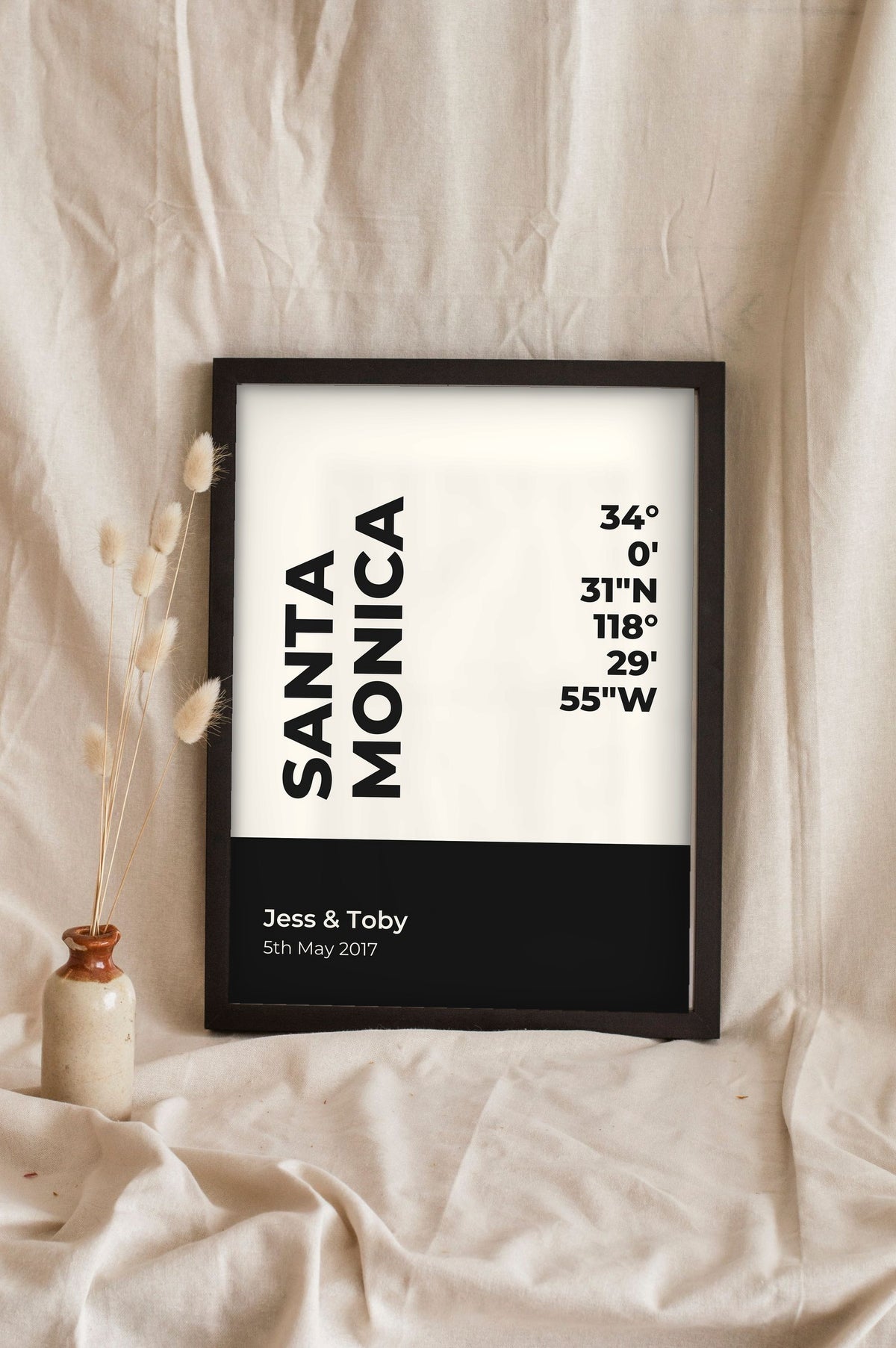 Lifestyle - Personalised Coordinates Print leaning in a frame with dried flowers