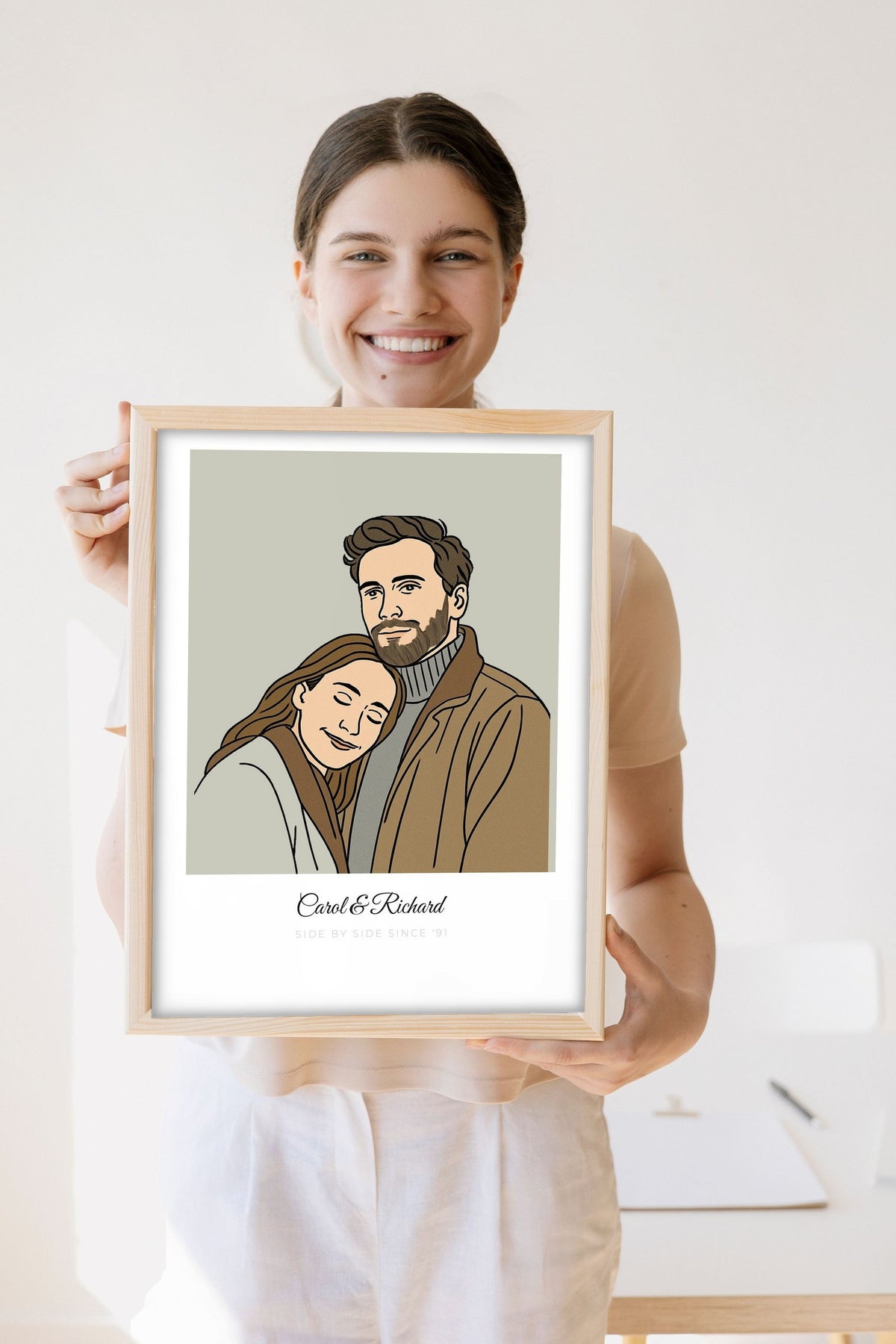 Lifestyle - Personalised Couples Line Portrait Print held by a smiling woman