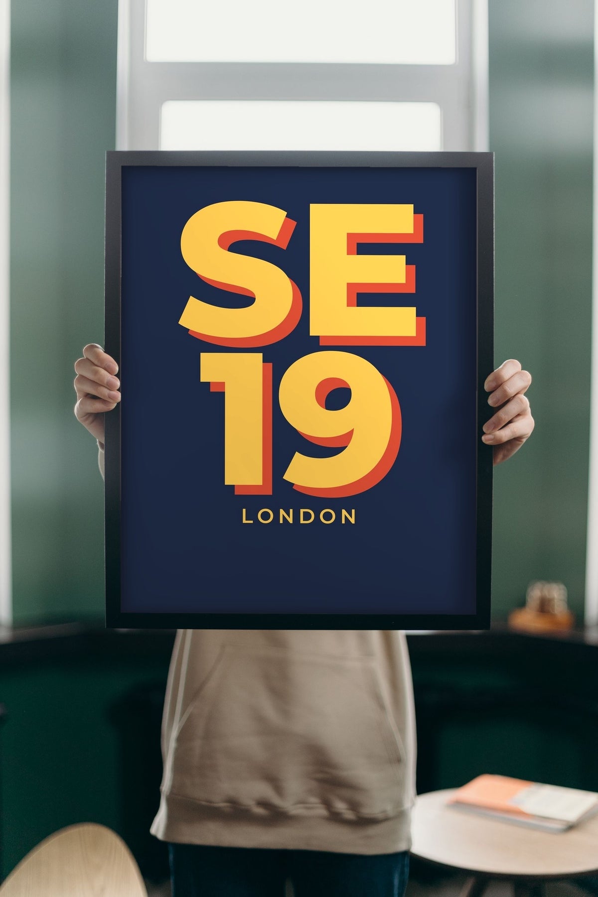Lifestyle - Personalised Postcode Print held up in a bright room