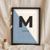 Lifestyle - Personalised Nursery Name Print leaning in a frame with dried flowers
