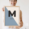 Lifestyle - Personalised Nursery Name Print held by a smiling woman