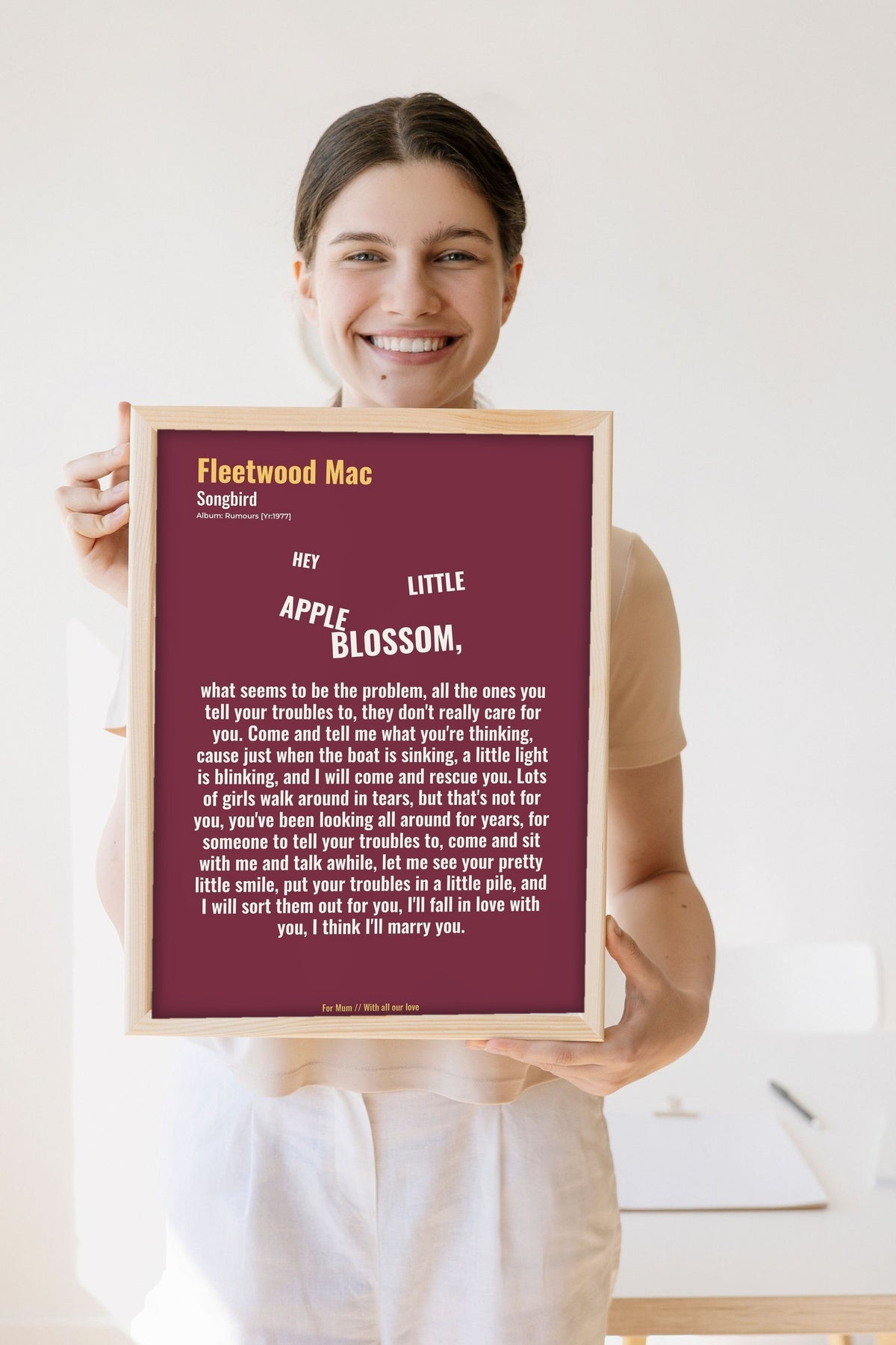 Lifestyle - Personalised Song Lyrics Print held by a smiling woman